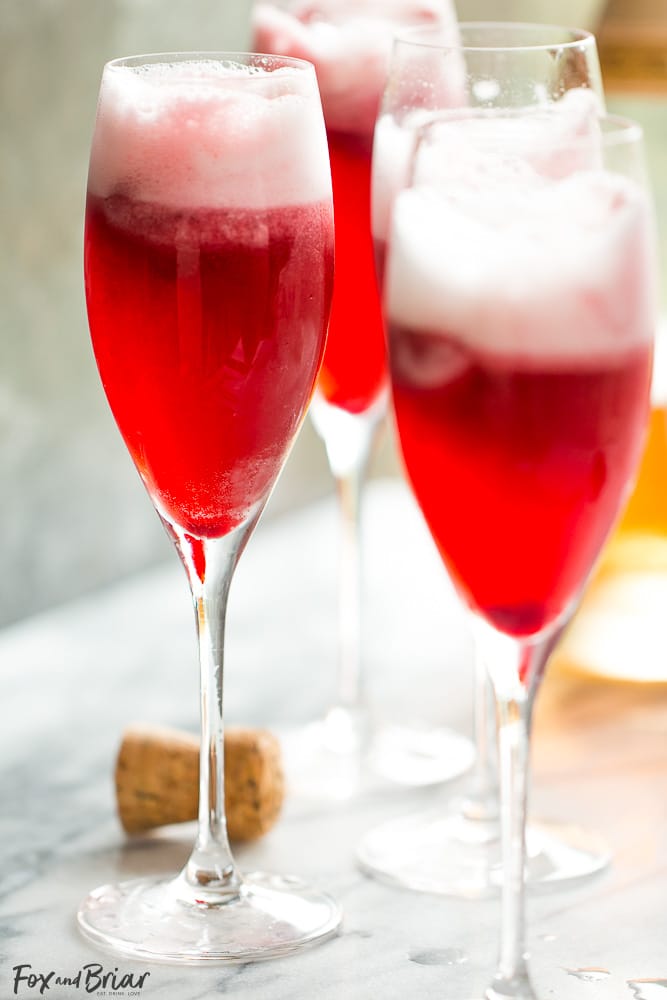 Rosé Raspberry Sorbet Mimosas are a fun cocktail for Mother's Day, bridal showers, brunch or just a girls get together. These girly cocktails are so easy to make and everyone will love them! | Bridal Shower drinks | Mother's Day drinks | Brunch cocktails | easy mimosa | sorbet mimosa | pink drink