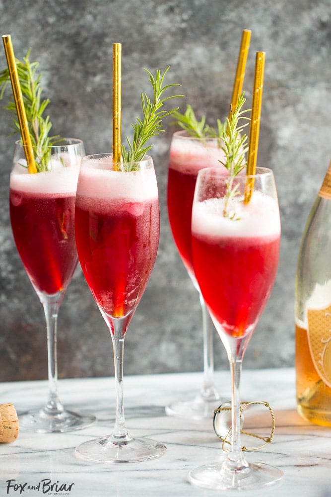 Rosé Raspberry Sorbet Mimosas are a fun cocktail for Mother's Day, bridal showers, brunch or just a girls get together. These girly cocktails are so easy to make and everyone will love them! | Bridal Shower drinks | Mother's Day drinks | Brunch cocktails | easy mimosa | sorbet mimosa | pink drink