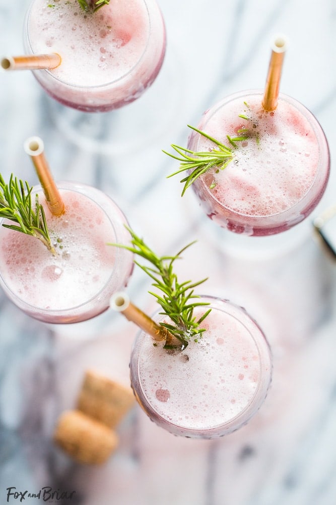 Rosé Raspberry Sorbet Mimosas are a fun cocktail for Mother's Day, bridal showers, brunch or just a girls get together. These girly cocktails are so easy to make and everyone will love them! | Bridal Shower drinks | Mother's Day drinks | Brunch cocktails | easy mimosa | sorbet mimosa | pink drink