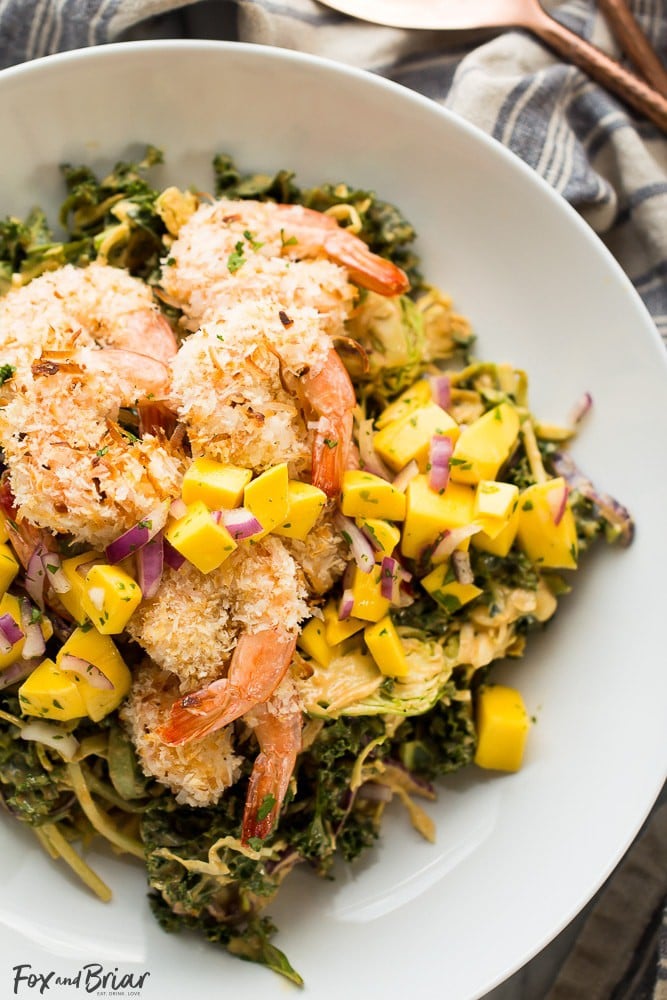 This delicious and tropical Coconut Shrimp Salad is topped with a fresh mango salsa and the most addictive peanut sauce dressing ever!