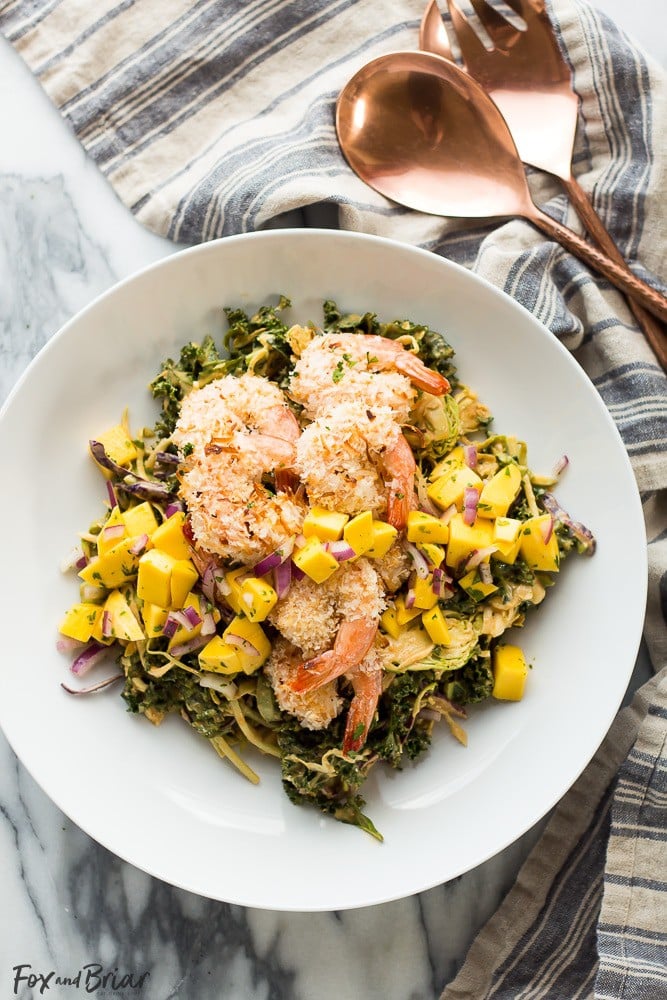 This delicious and tropical Coconut Shrimp Salad is topped with a fresh mango salsa and the most addictive peanut sauce dressing ever!