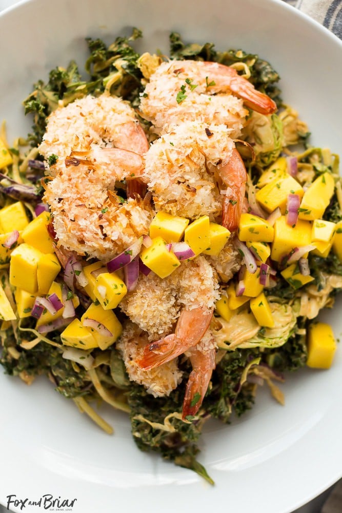 This delicious and tropical Coconut Shrimp Salad is topped with a fresh mango salsa and the most addictive peanut sauce dressing ever!