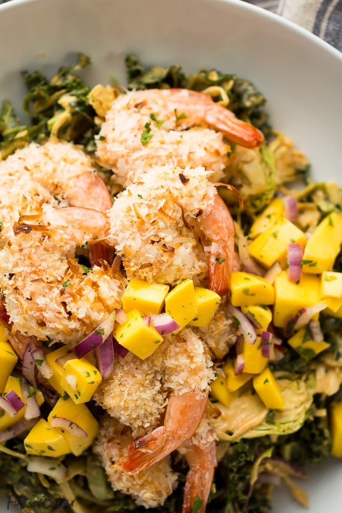 This delicious and tropical Coconut Shrimp Salad is topped with a fresh mango salsa and the most addictive peanut sauce dressing ever!