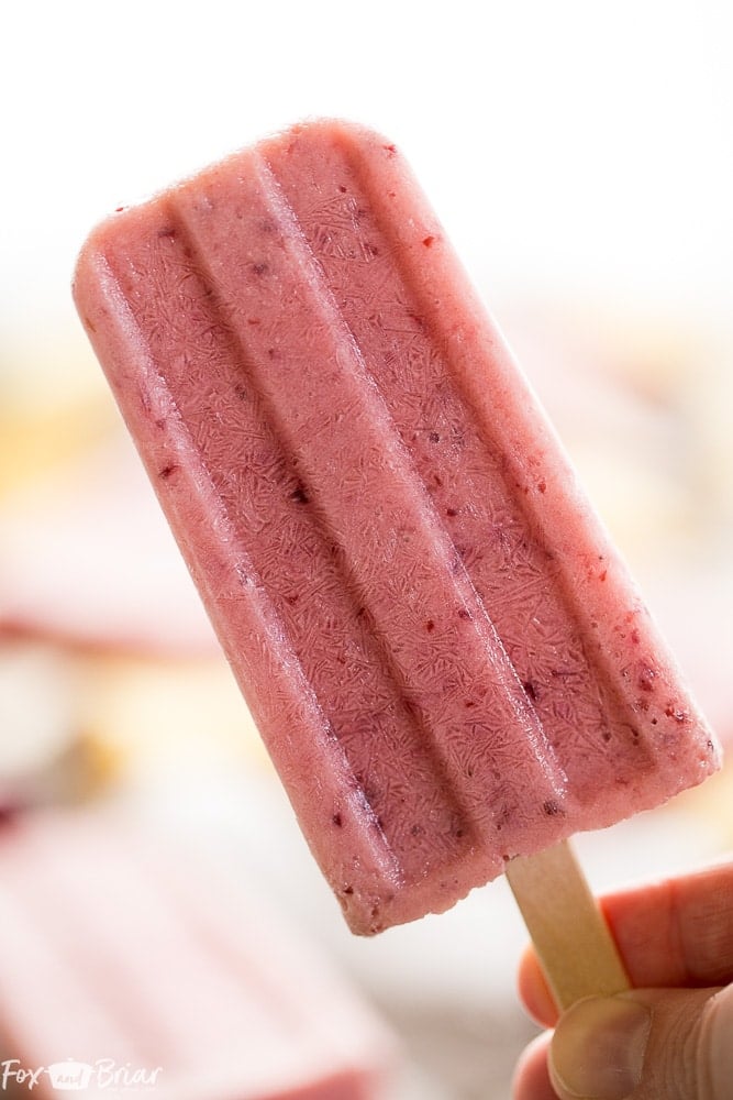 These Post Workout Smoothie Popsicles will keep you cool and refuel your body after a tough workout! Perfect for hot summer days, these healthy popsicles have no added sugar and and are a grab and go snack on busy days. | No added sugar popsicles | healthy popsicles | Healthy snack | Sugar Free Snack | 