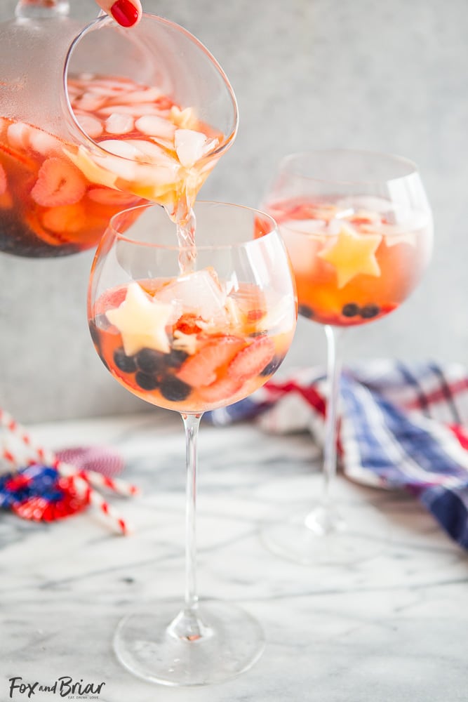 These Red, White, and Blue Wine Sparklers are the perfect festive drink for the Fourth of July. Refreshing and light on alcohol makes for easy drinking on a hot summer day! |patriotic drinks | red white and blue drinks | patriotic recipes | red white and blue recipe | fourth of july recipe