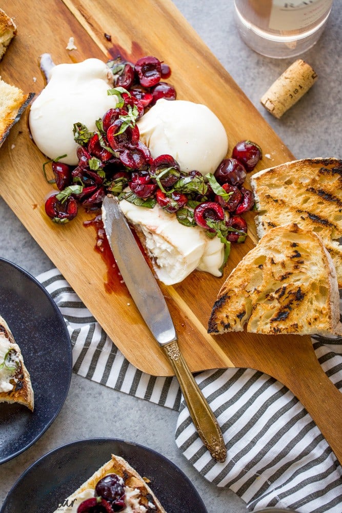 This Burrata with Balsamic Cherries and Basil the ultimate summer appetizer! Creamy, fresh burrata paired with juicy cherries and fragrant basil uses summer produce at its best, and no cooking required! Summer appetizers | Cherry Recipes | basil Recipes | burrata Recipes | party appetizers