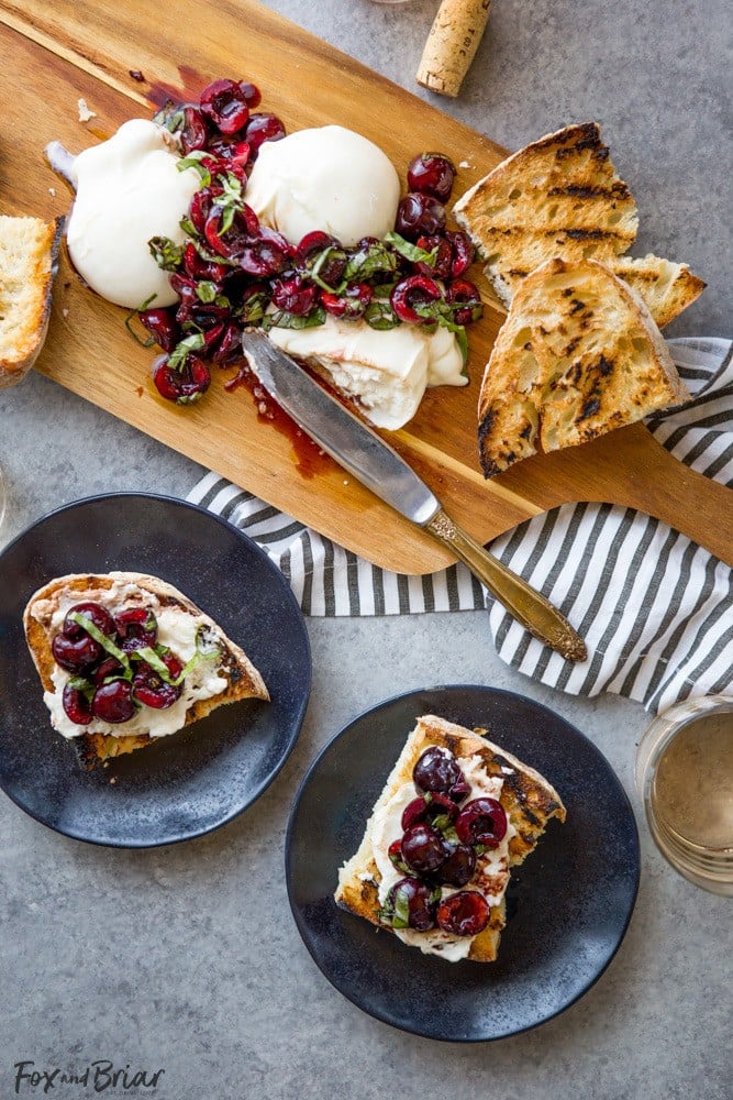 This Burrata with Balsamic Cherries and Basil the ultimate summer appetizer! Creamy, fresh burrata paired with juicy cherries and fragrant basil uses summer produce at its best, and no cooking required! Summer appetizers | Cherry Recipes | basil Recipes | burrata Recipes | party appetizers