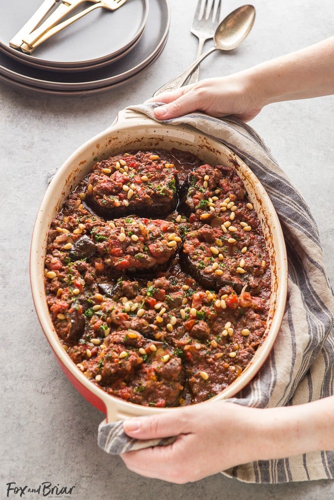 This Meat Stuffed Eggplant is full of delicious flavor, and is a hearty and low-carb dinner! Cinnamon-scented lamb, tomatoes and toasted pine nuts make this dish unique and you will want to keep coming back for more! | Lamb Recipes | Eggplant Recipes | Low Carb Dinner Recipes | Gluten Free Recipes | Winter Recipes | Middle Eastern Recipes | Syrian Recipes 