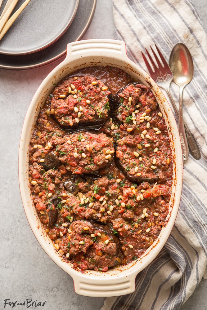 This Meat Stuffed Eggplant is full of delicious flavor, and is a hearty and low-carb dinner! Cinnamon-scented lamb, tomatoes and toasted pine nuts make this dish unique and you will want to keep coming back for more! | Lamb Recipes | Eggplant Recipes | Low Carb Dinner Recipes | Gluten Free Recipes | Winter Recipes | Middle Eastern Recipes | Syrian Recipes 