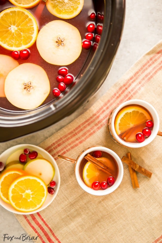 This Crock Pot Cranberry Pear Cider is made from scratch in your slow cooker! A festive, warm fall and winter beverage, perfect for Thanksgiving or Christmas! |crock pot recipe | Slow Cooker Recipe | Cider in the crockpot | slow cooker cider recipe | fall drink | warm drinks | non-alcoholic drink for christmas | thanksgiving drink