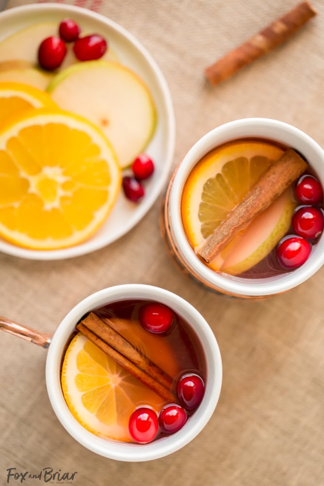 This Crock Pot Cranberry Pear Cider is made from scratch in your slow cooker! A festive, warm fall and winter beverage, perfect for Thanksgiving or Christmas! |crock pot recipe | Slow Cooker Recipe | Cider in the crockpot | slow cooker cider recipe | fall drink | warm drinks | non-alcoholic drink for christmas | thanksgiving drink