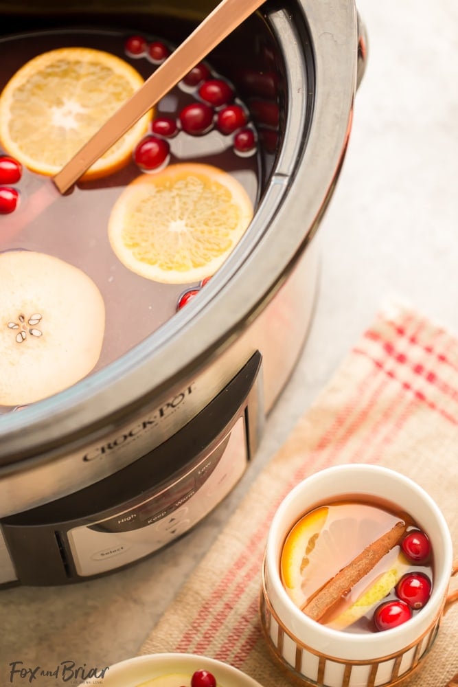 This Crock Pot Cranberry Pear Cider is made from scratch in your slow cooker! A festive, warm fall and winter beverage, perfect for Thanksgiving or Christmas! |crock pot recipe | Slow Cooker Recipe | Cider in the crockpot | slow cooker cider recipe | fall drink | warm drinks | non-alcoholic drink for christmas | thanksgiving drink