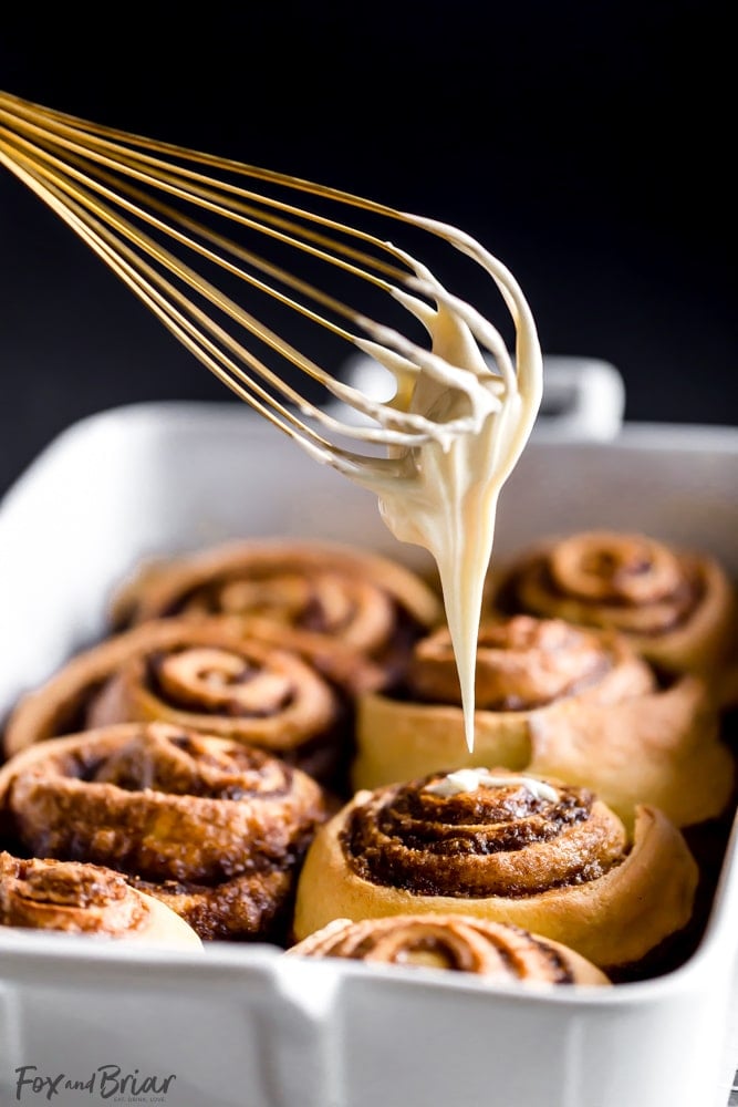 These giant, soft, Eggnog Cinnamon Rolls are the perfect Christmas morning breakfast! Gooey, pillowy and full of cinnamon spice with an extra holiday pop of eggnog flavor in the creamy icing. | Christmas Morning Breakfast Recipe | Eggnog Recipes | Holiday Recipe | Christmas Brunch Recipe | Holiday Brunch | Holiday baking | Christmas Baking