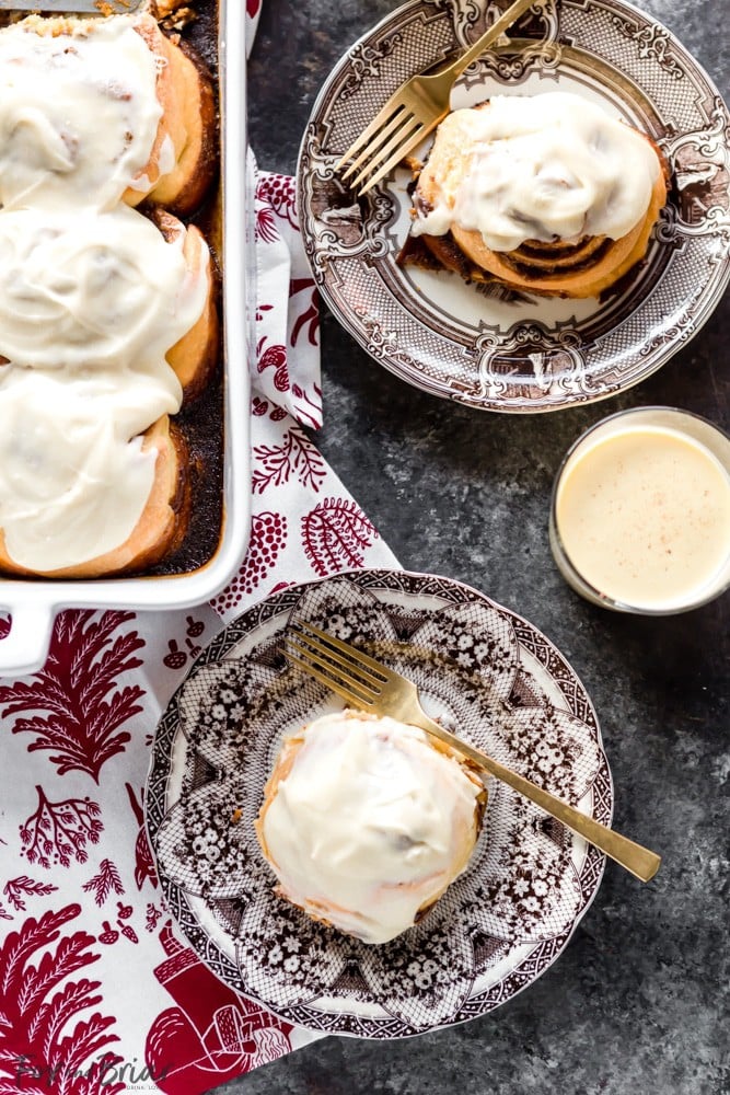 These giant, soft, Eggnog Cinnamon Rolls are the perfect Christmas morning breakfast! Gooey, pillowy and full of cinnamon spice with an extra holiday pop of eggnog flavor in the creamy icing. | Christmas Morning Breakfast Recipe | Eggnog Recipes | Holiday Recipe | Christmas Brunch Recipe | Holiday Brunch | Holiday baking | Christmas Baking