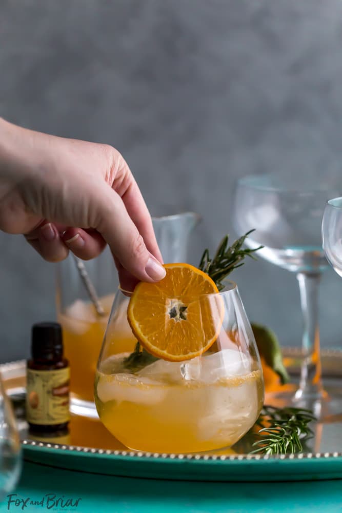 This non-alcoholic Rosemary Clementine Sparkler is a sophisticated mocktail perfect for the holidays. Non-Alcoholic Recipes | Pregnancy drinks | Drinks for teens | Baby Shower drinks | Dry January | Winter Mocktail | Non-alcoholic party drink | Sparkling mocktail | New Years Mocktail 