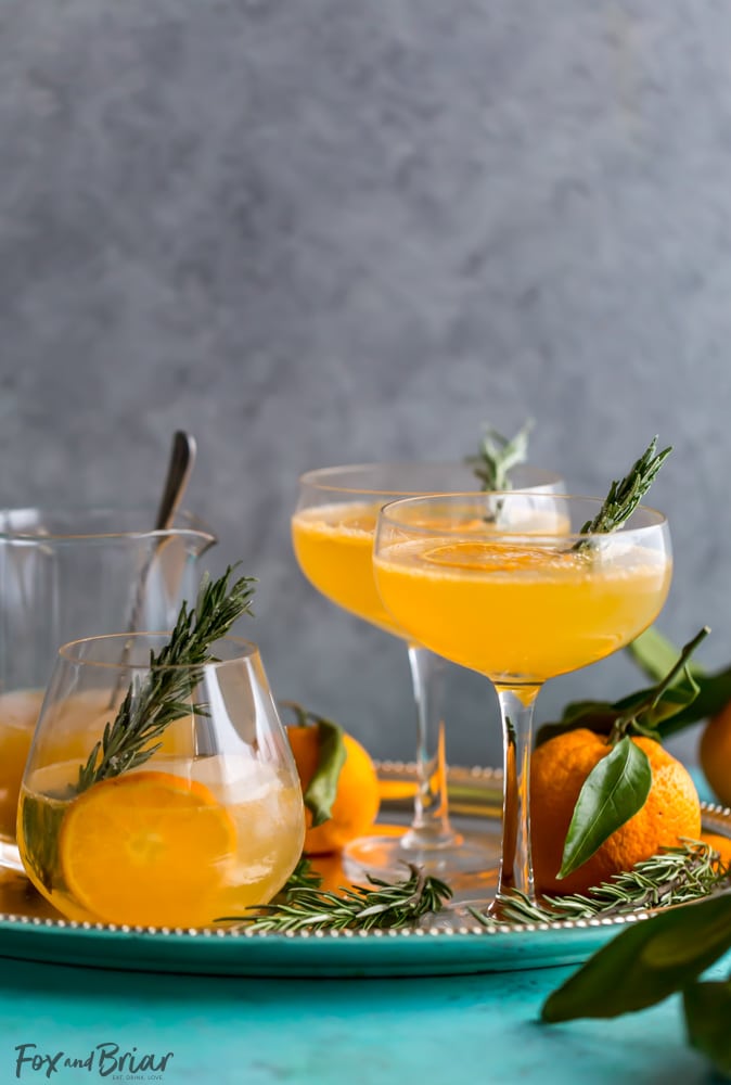 This non-alcoholic Rosemary Clementine Sparkler is a sophisticated mocktail perfect for the holidays. Non-Alcoholic Recipes | Pregnancy drinks | Drinks for teens | Baby Shower drinks | Dry January | Winter Mocktail | Non-alcoholic party drink | Sparkling mocktail | New Years Mocktail 
