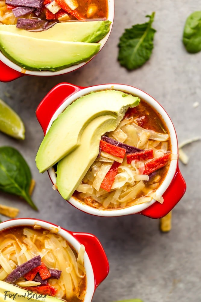 Veggie Packed, Healthy Slow Cooker Chicken Tortilla Soup and Southwest Salad | Crock Pot Chicken Tortilla Soup | Easy Chicken Tortilla Soup | Veggie Packed Meals | Easy Weeknight Dinner | Easy Meal to serve a crowd | Low Carb Chicken Tortilla Soup | Black Beans | Avocados | Lime Juice | Corn | Chicken Tortilla Soup Recipe #ad #GotoGreens #TaylorFarms