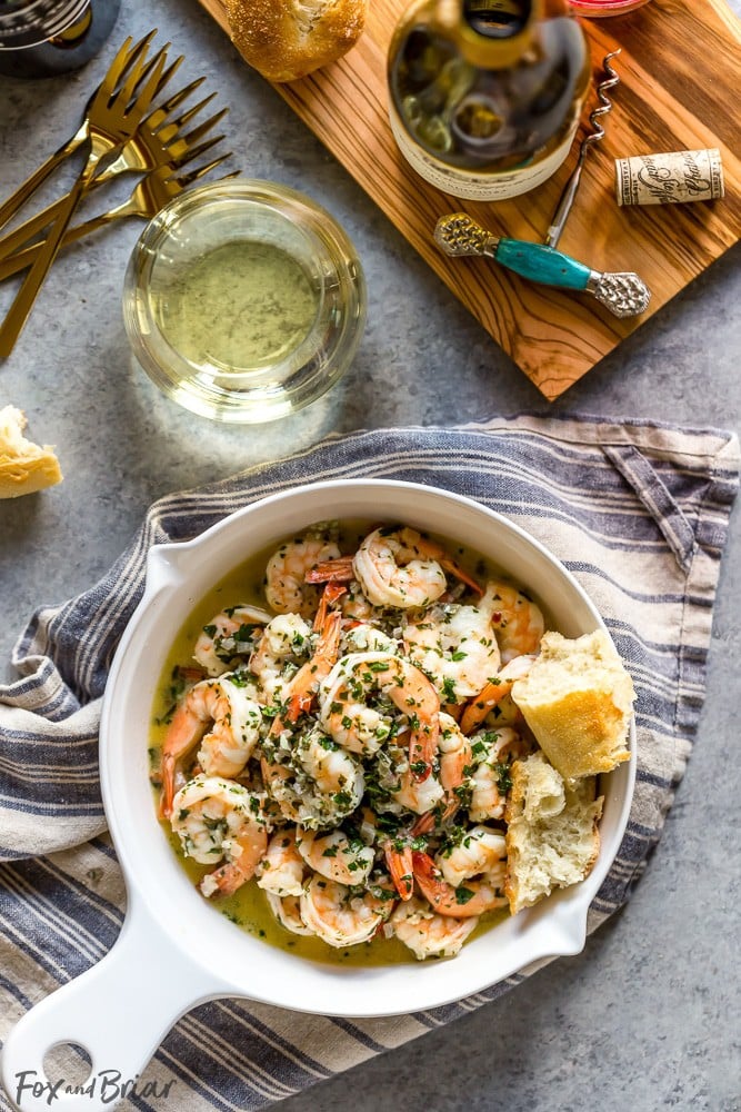 This Shrimp Scampi with White Wine has a garlicky, buttery sauce, balanced by the bright freshness of wine, lemon juice and parsley. It's fantastic mixed with pasta, over rice, or just with crusty bread for dipping in the sauce. | Easy shrimp scampi recipe | Best shrimp scampi @QFCGrocery #WAWineMonth  #sponsored