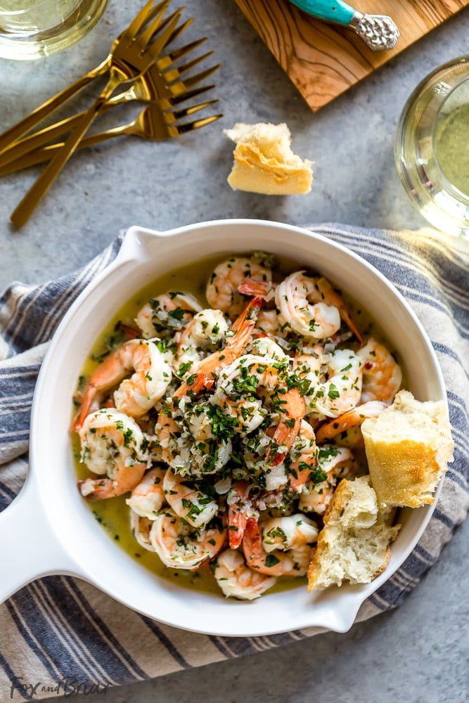 This Shrimp Scampi with White Wine has a garlicky, buttery sauce, balanced by the bright freshness of wine, lemon juice and parsley. It's fantastic mixed with pasta, over rice, or just with crusty bread for dipping in the sauce. | Easy shrimp scampi recipe | Best shrimp scampi @QFCGrocery #WAWineMonth  #sponsored