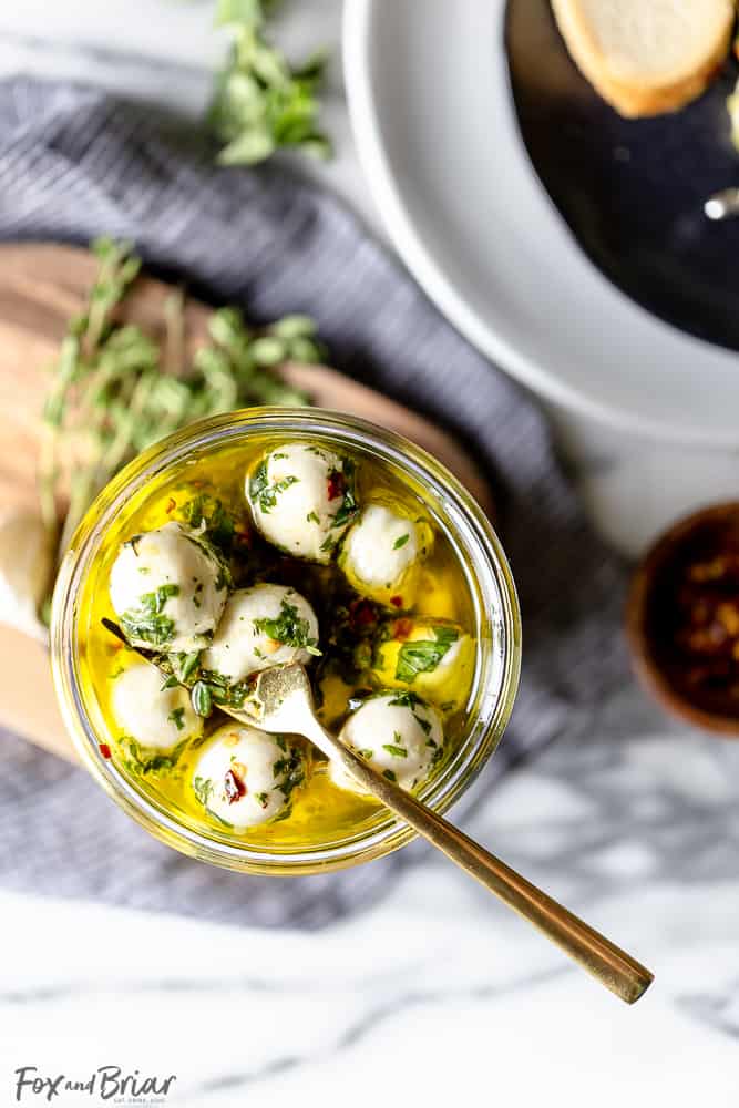 These Olive Oil Marinated Mozzarella Balls are a quick and easy appetizer that takes less than 15 minutes to make. @bertolli #ad #TheRecipeIsSimple | Make Ahead | For a party | Quick | For a crowd | cold appetizer | no cook | bites | finger food | snacks | Low carb appetizers