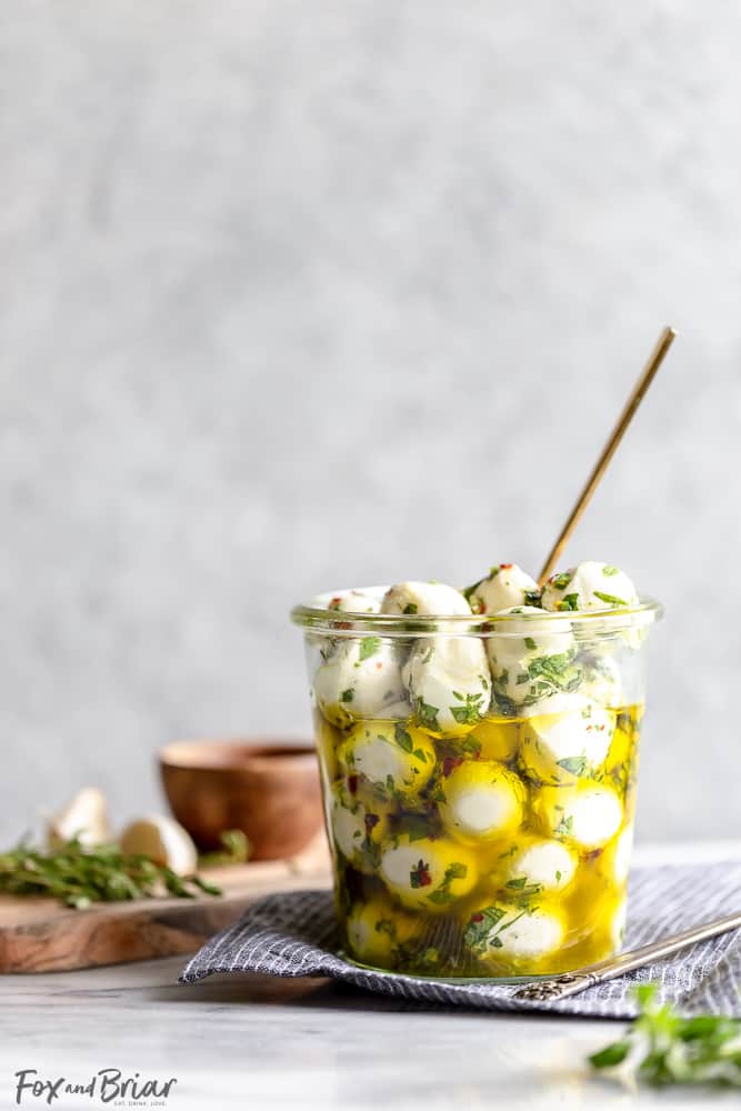 These Olive Oil Marinated Mozzarella Balls are a quick and easy appetizer that takes less than 15 minutes to make. @bertolli #ad #TheRecipeIsSimple | Make Ahead | For a party | Quick | For a crowd | cold appetizer | no cook | bites | finger food | snacks | Low carb appetizers