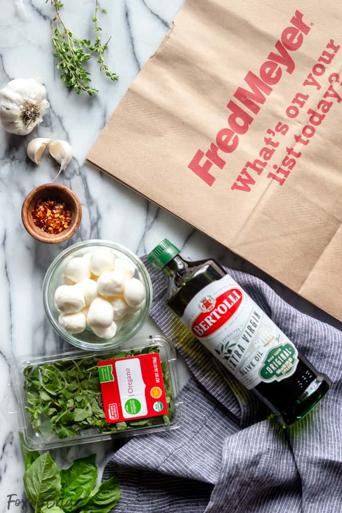 These Olive Oil Marinated Mozzarella Balls are a quick and easy appetizer that takes less than 15 minutes to make. @bertolli #ad #TheRecipeIsSimple | Make Ahead | For a party | Quick | For a crowd | cold appetizer | no cook | bites | finger food | snacks | Low carb appetizers