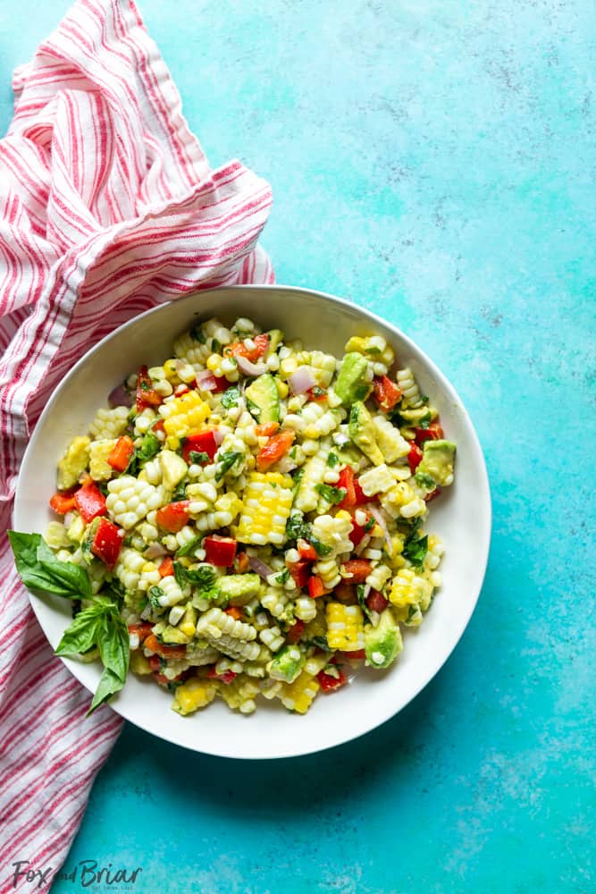 This Fresh Summer Corn Salad is the best side dish to bring to a BBQ, cookout or picnic!  It uses fresh summer produce and can be made ahead of time. | Easy Corn Salad Recipe | BBQ Side Dish | Potluck | cookout | labor day | Fourth of July | Memorial day | Barbque side | Cold food | Make ahead | food to bring to a party