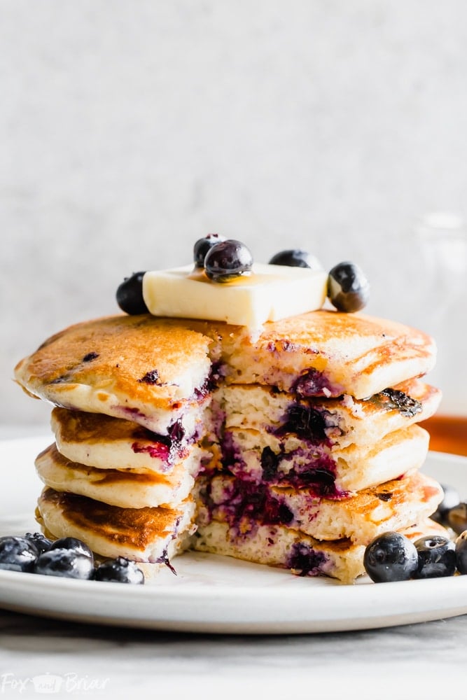 How to make the best buttermilk blueberry pancakes.  Fluffy and tender blueberry pancakes from scratch make the best weekend breakfast or brunch! | Blueberry pancake recipe | Pancakes from scratch | Fluffy blueberry pancakes | Buttermilk blueberry pancake recipe | Tender pancakes | Easy pancake recipe | Homemade pancakes | breakfast recipe | blueberry recipe | Best blueberry pancakes