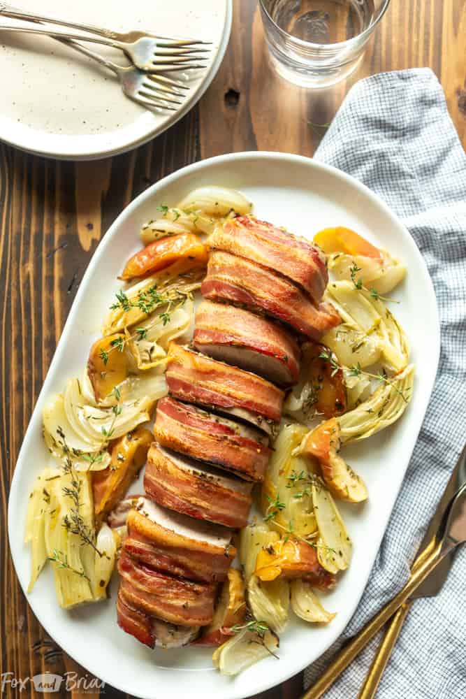 This Bacon Wrapped Pork Tenderloin is the juiciest, most flavorful pork tenderloin you have ever made! Garlic, herbs and bacon make this easy pork recipe fancy enough for hosting company, but it is simple enough for a weeknight meal. Pork recipes | Easy pork tenderloin recipe | Pork Tenderloin in oven | Baked pork tenderloin | Roasted Pork Tenderloin @safeway #opennature #ad