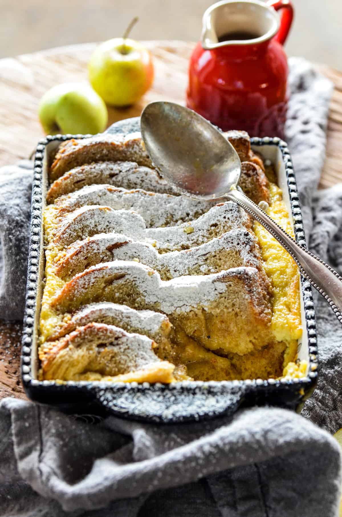 Apple Cardamom Bread Pudding is the best bread pudding we have ever had! This Apple Cardamom Bread Pudding recipe has sweet apples and citrusy cardamom for an indulgent dessert perfect for your next dinner party!