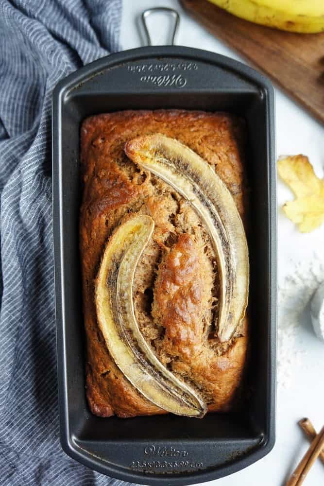 This delicious, moist and fluffy banana bread is so easy to make and even easier to eat!  With the addition of my favorite spices, it’s the perfect breakfast treat to warm you up on a chilly morning! | Easy banana bread recipe | Moist banana bread | Simple Banana Bread | with cinnamon 