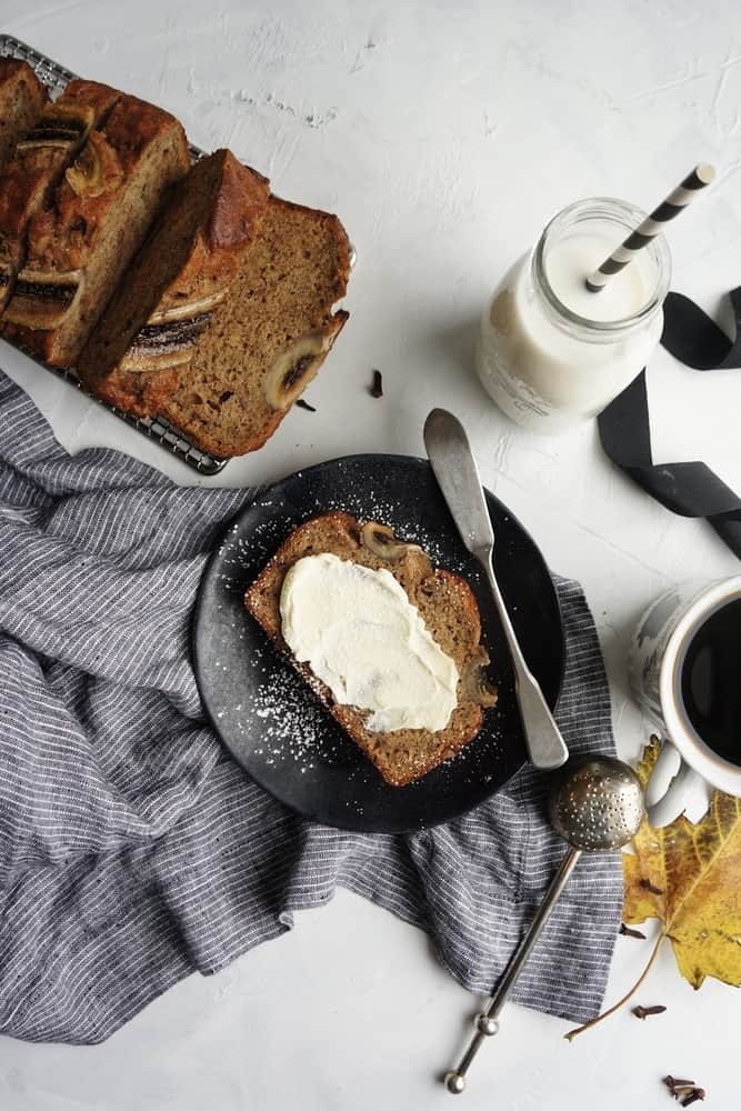 This delicious, moist and fluffy banana bread is so easy to make and even easier to eat!  With the addition of my favorite spices, it’s the perfect breakfast treat to warm you up on a chilly morning! | Easy banana bread recipe | Moist banana bread | Simple Banana Bread | with cinnamon 