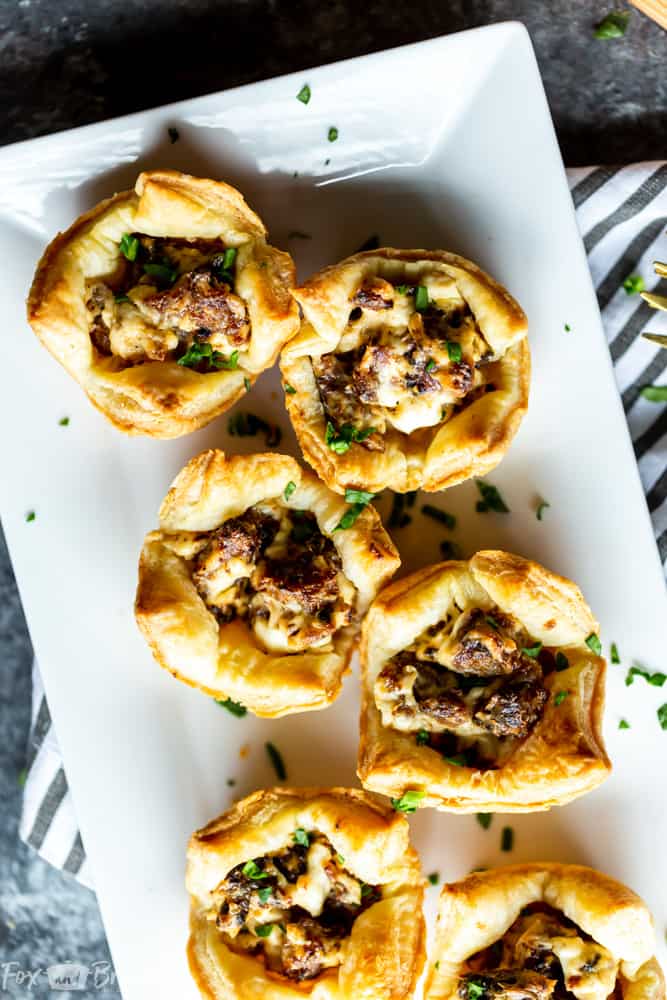 Easy Sausage Cream Cheese Bites - These Three ingredient, Easy Appetizers take under half an hour to make and are a crowd favorite!  The perfect party appetizer for New Year's Eve, Christmas, Thanksgiving or any other party. | Game Day | football food | superbowl | Sausage appetizer | Sausage cream cheese crescents 