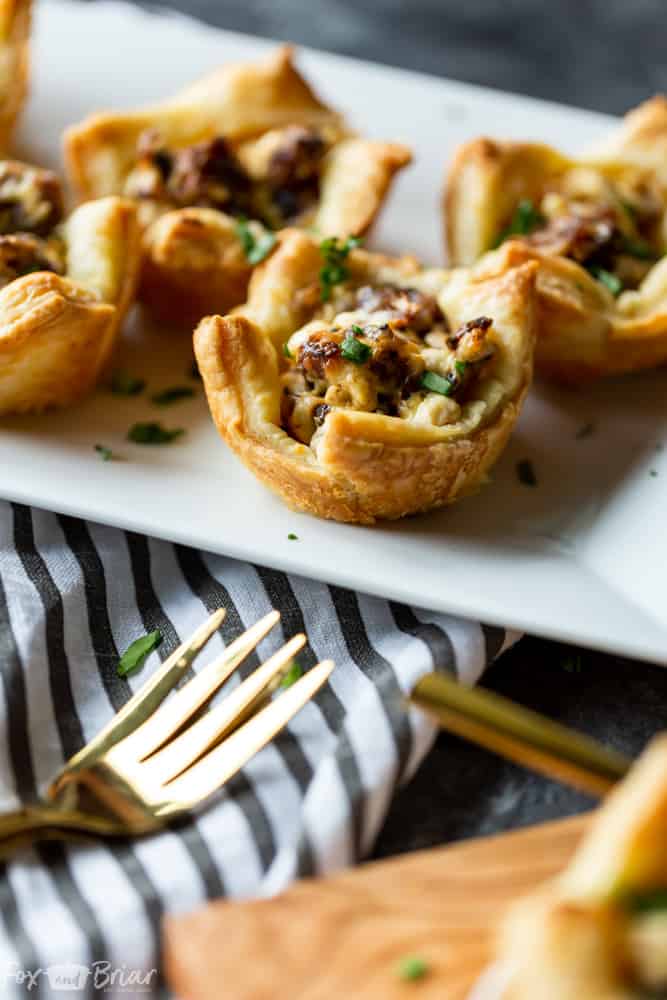 Easy Sausage Cream Cheese Bites - These Three ingredient, Easy Appetizers take under half an hour to make and are a crowd favorite!  The perfect party appetizer for New Year's Eve, Christmas, Thanksgiving or any other party. | Game Day | football food | superbowl | Sausage appetizer | Sausage cream cheese crescents 