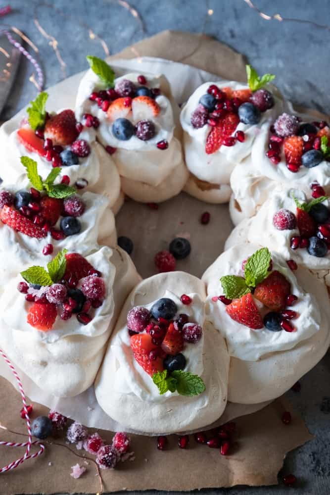 The Christmas desserts of all Christmas desserts! This pavlova wreath is an absolutely gorgeous dessert recipe that will wow your Christmas guests! A beautiful showstopper for the table and with some easy tips and tricks, you’ll be nailing this in no time! Pavlova | Dessert recipe | Christmas dessert 