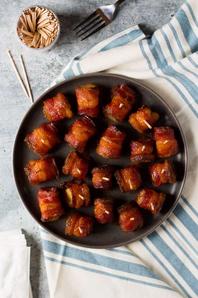 These Brown Sugar Bacon Wrapped Pineapple Bites are easy appetizers for parties, tailgating, or to eat as snacks. | Easy appetizer | Superbowl food ideas | Party appetizer | Bacon recipes | Hawaiian food | Pineapple recipes | football party food 