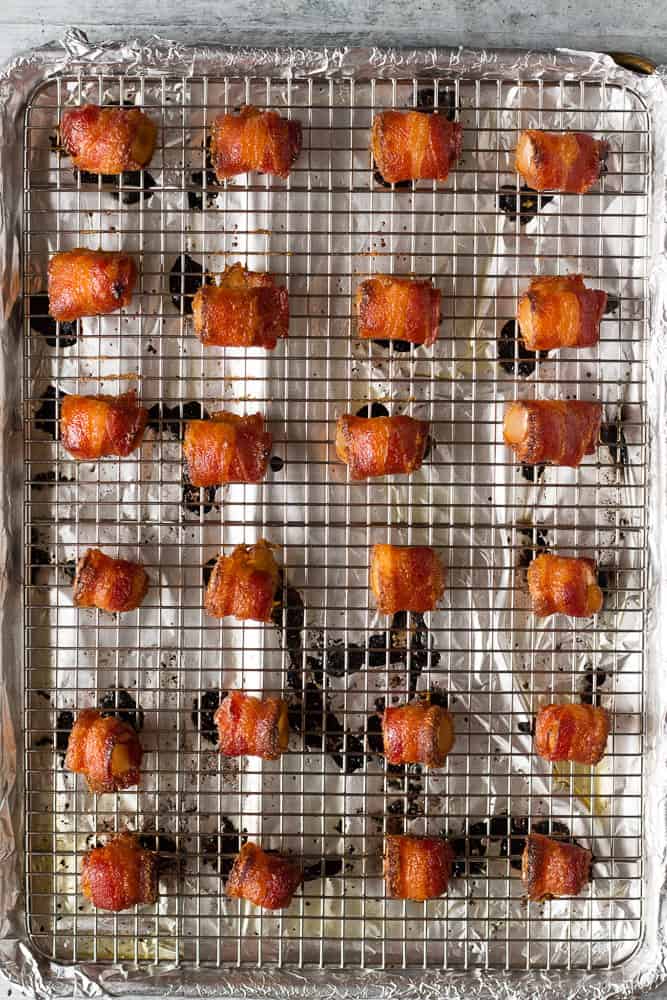 These Brown Sugar Bacon Wrapped Pineapple Bites are easy appetizers for parties, tailgating, or to eat as snacks. | Easy appetizer | Superbowl food ideas | Party appetizer | Bacon recipes | Hawaiian food | Pineapple recipes | football party food 