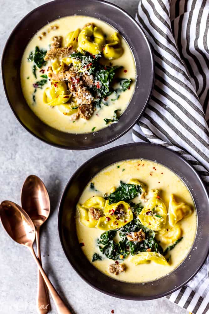 This Creamy Sausage and Tortellini Soup only has five ingredients and is ready in 30 minutes! Make this easy and delicious soup for dinner tonight! | Sausage and Kale Soup | Zuppa Toscana | Creamy sausage soup | Sausage and tortellini soup | with kale