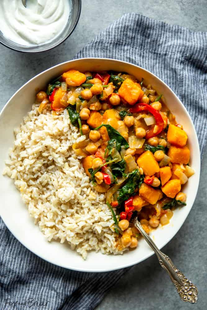 This easy Chickpea Curry is a great healthy meal prep idea, as well as a quick weeknight dinner recipe! Packed with veggies, this chickpea curry is also gluten free and easily made vegan! #mealprep #meatless #healthydinner | Meal Prep Idea | Easy and healthy dinner | quick dinner recipe | Meatless monday | Plant Based | vegan option | Gluten Free | Quick dinner idea