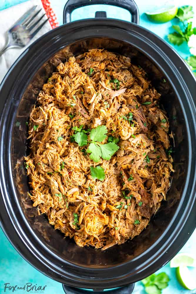 This delicious Slow Cooker Carnitas recipe is tender and juicy, yet simple to make.  Mexican pulled pork is great to have on hand for carnitas tacos, burrito bowls, salads, sandwiches and more. | Easy pork carnitas | Crock Pot Carnitas | Chipotle copycat | Crispy carnitas | Keto Carnitas