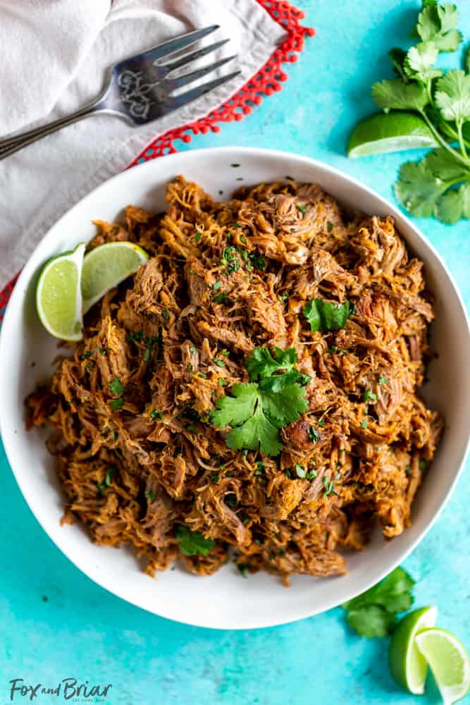 This delicious Slow Cooker Carnitas recipe is tender and juicy, yet simple to make.  Mexican pulled pork is great to have on hand for carnitas tacos, burrito bowls, salads, sandwiches and more. | Easy pork carnitas | Crock Pot Carnitas | Chipotle copycat | Crispy carnitas | Keto Carnitas