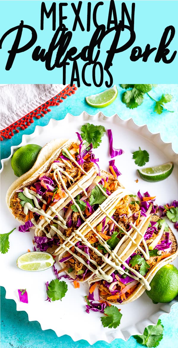 These Slow Cooker Mexican Pulled Pork Tacos have juicy pulled pork, crunchy cilantro lime slaw and creamy avocado crema, all piled in a soft tortilla.  Slow Cooker Pork Tacos | Easy Pork Tacos | Pulled Pork Tacos | How to make pork tacos at home | Shredded pork tacos | Carnitas 