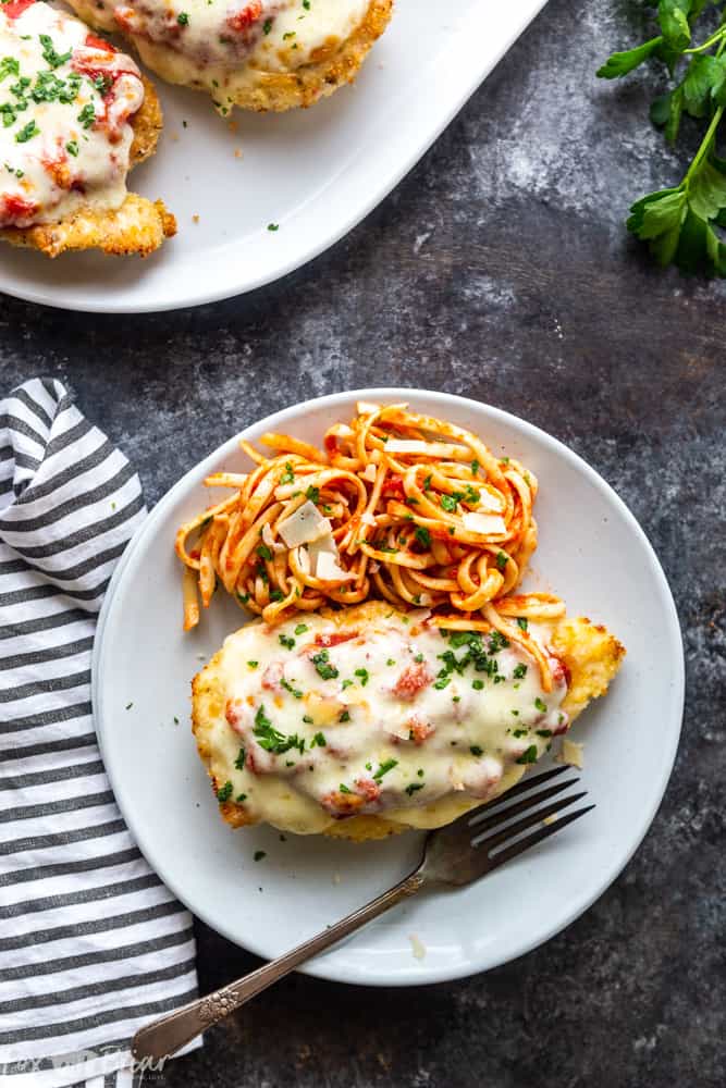 This delicious Oven Baked Chicken Parmesan recipe is easy and doesn't require any frying.  Because this chicken Parmesan is baked, it is healthy, quick and easy! Make this crispy baked Parmesan crusted chicken for dinner tonight in about thirty minutes! Easy dinner recipe | Chicken recipe | Dinner recipe | Chicken breast recipe | Italian recipe | Olive garden copycat | Healthy panko crusted chicken | Parmesan crusted chicken
