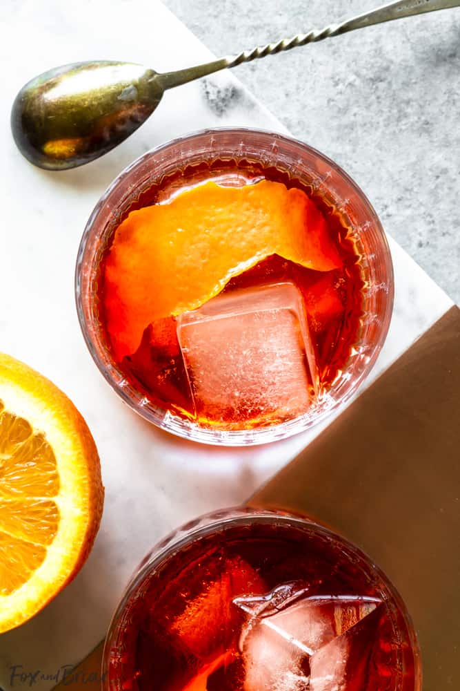 Closeup overhead of negroni with ice and orange peel