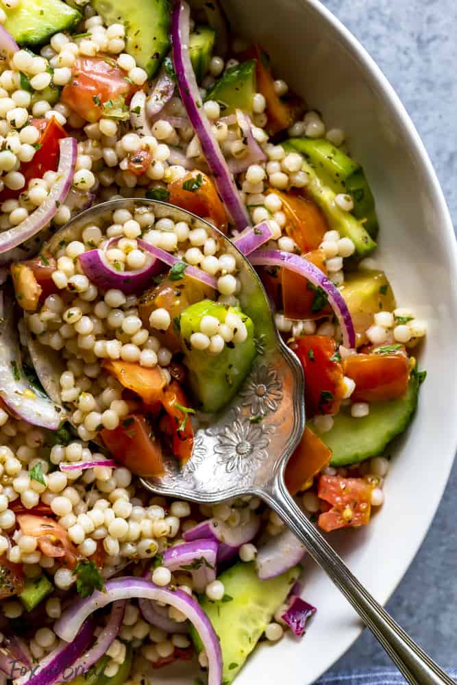 Pearl Couscous salad with cucumbers, tomatoes and onion