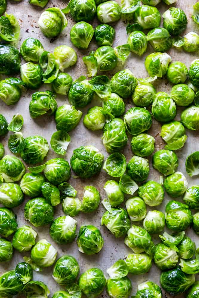 These Easy Roasted Brussels Sprouts have only four ingredients and are so simple to make!  Brussels Sprouts make a great side dish for a weeknight dinner or even a special holiday meal like Thanksgiving or Christmas! | oven baked brussels sprouts | easy brussels sprouts | side dish recipes | Christmas dinner ideas | thanksgiving recipes | thanksgiving side dishes | easy side dishes | brussels sprouts recipes