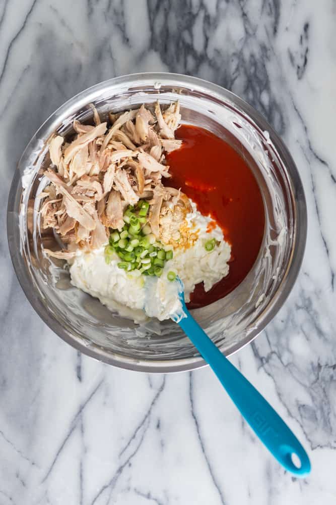 ingredients for buffalo chicken dip together in a bowl