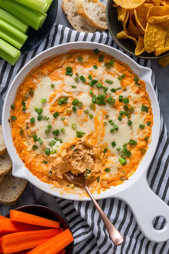 Buffalo Chicken Dip with carrots, celery, tortilla chips