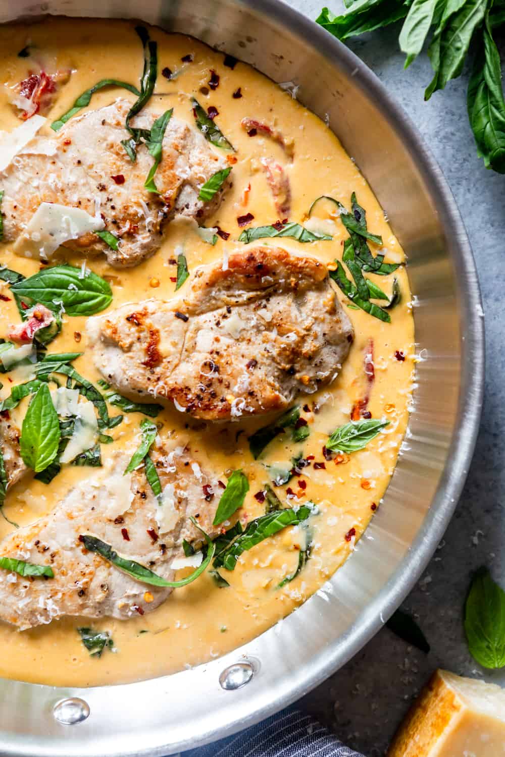 Seared Pork chops in a creamy sauce in a skillet