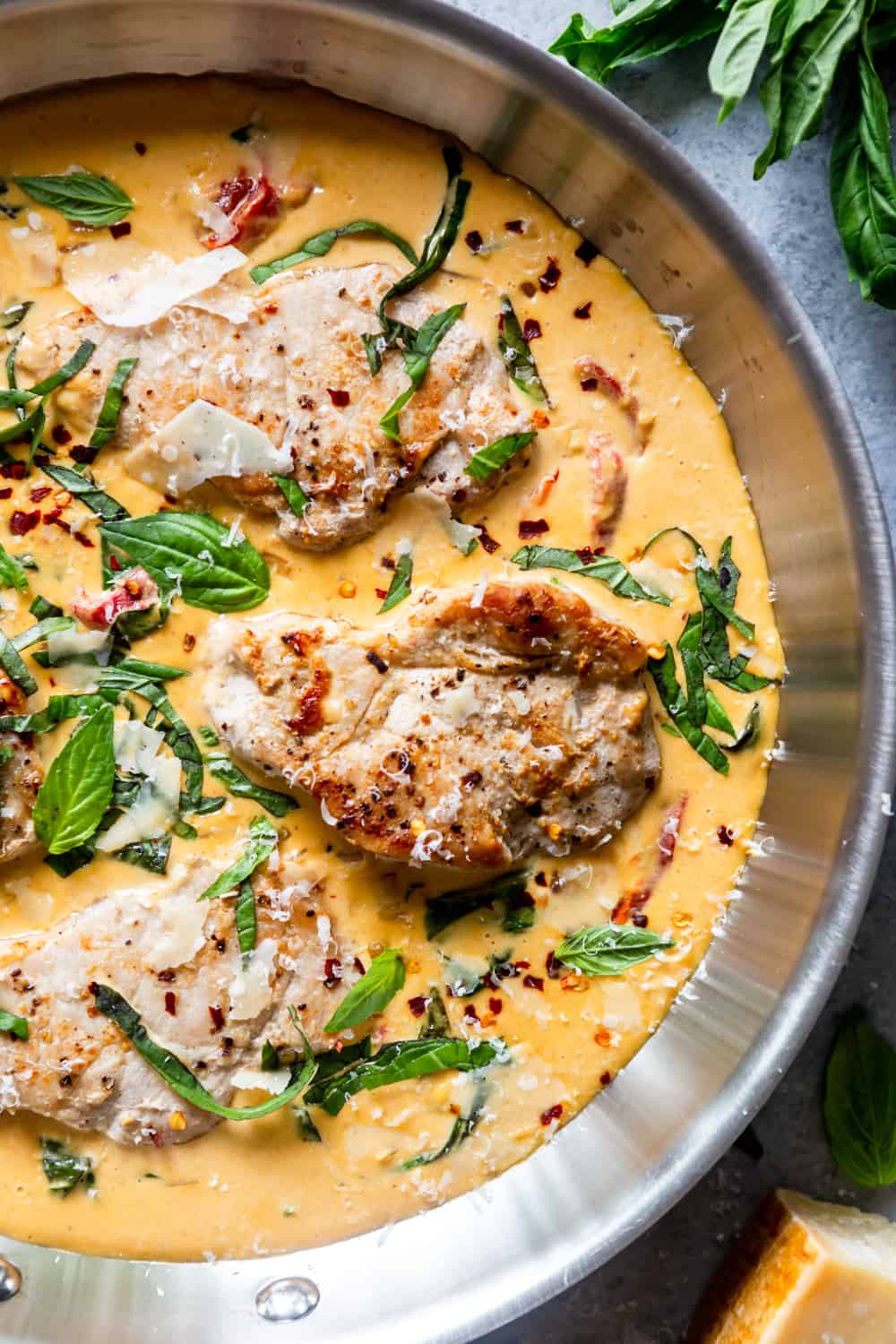 pork chops in creamy sauce in a skillet